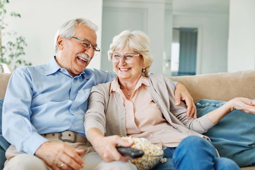 Happy couple smiling together, representing Dentures and Partial Dentures in Jackson, WY