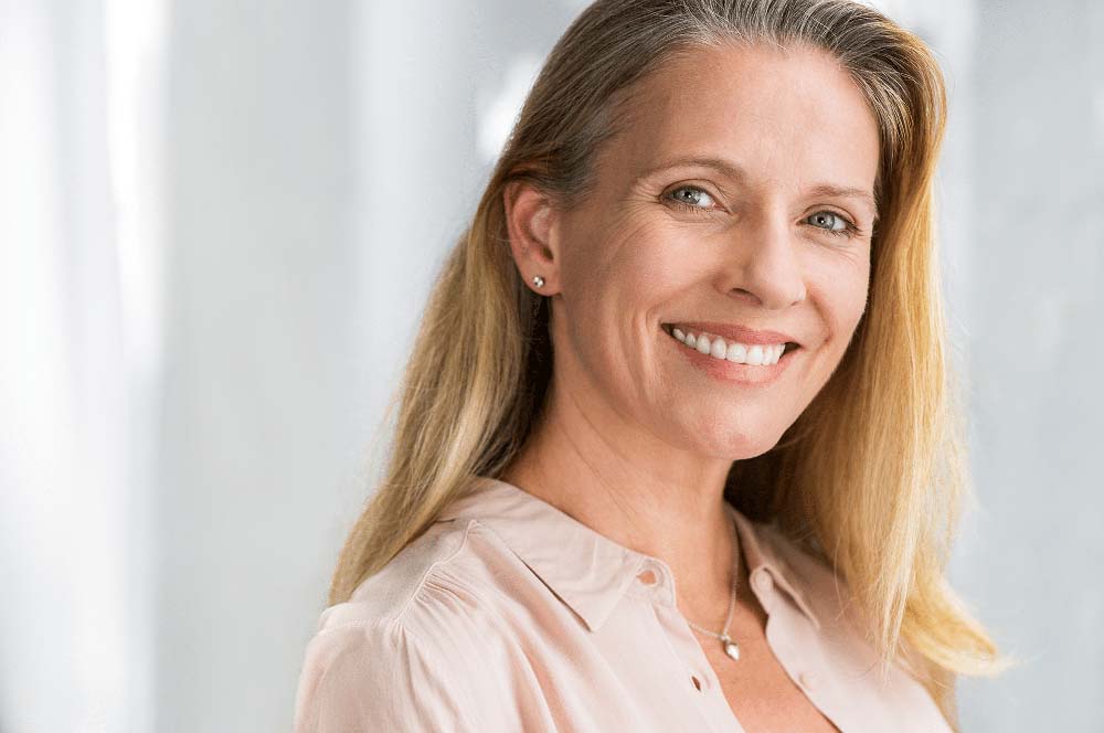 Confident woman with healthy smile, representing Gum Recession in Jackson Hole