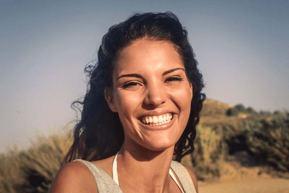Close-up of woman with radiant smile, highlighting professional dental results in Periodontal Disease And Pregnancy