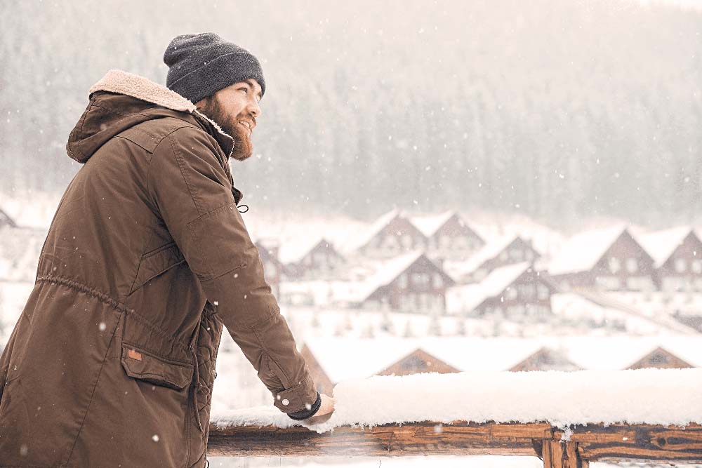 Man enjoying winter outdoors, representing Porcelain Fixed Dental Bridges in Jackson Hole, WY