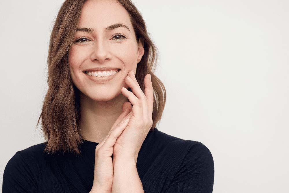 Close-up of woman with bright, healthy smile after Periodontal treatment